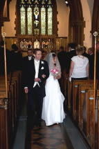 Couple walking out down the aisle at St Paul’s after marriage